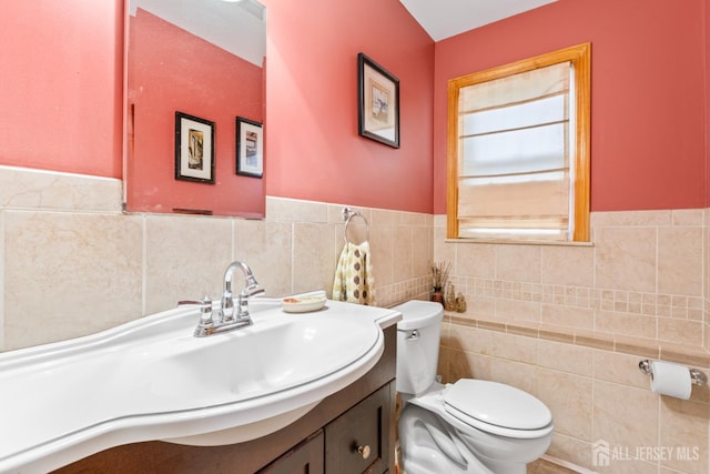44 Pleasant Ave, Iselin, NJ 08830 - half bath featuring tile walls, vanity, and a wainscoted wall