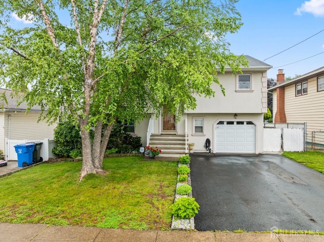 44 Pleasant Ave, Iselin, NJ 08830 - view of front of property featuring a garage, stucco siding, and driveway
