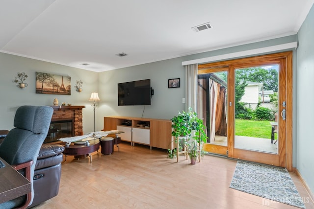 44 Pleasant Ave, Iselin, NJ 08830 - living room with light wood-type flooring, ornamental molding, and a fireplace