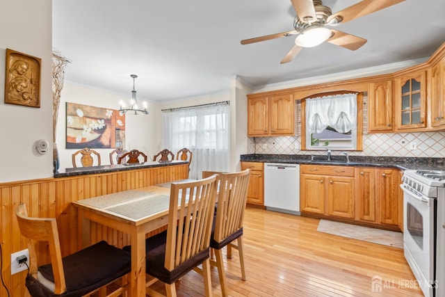 44 Pleasant Ave, Iselin, NJ 08830 - kitchen with a chandelier, white appliances, dark countertops, decorative backsplash, and glass insert cabinets