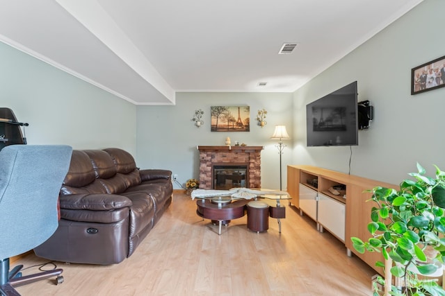 44 Pleasant Ave, Iselin, NJ 08830 - living room featuring wood finished floors, a stone fireplace, and ornamental molding