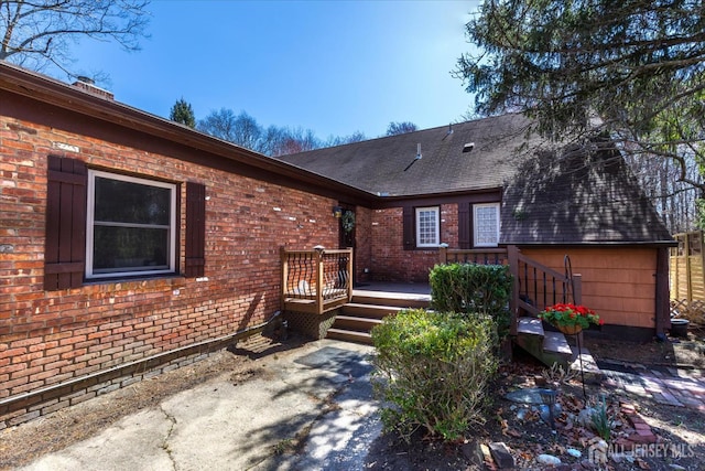 75 Brown Rd, Howell, NJ 07731 - back of house featuring a wooden deck, brick siding, and a shingled roof