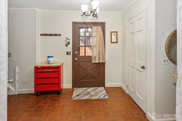 75 Brown Rd, Howell, NJ 07731 - entryway with brick flooring, a chandelier, and crown molding