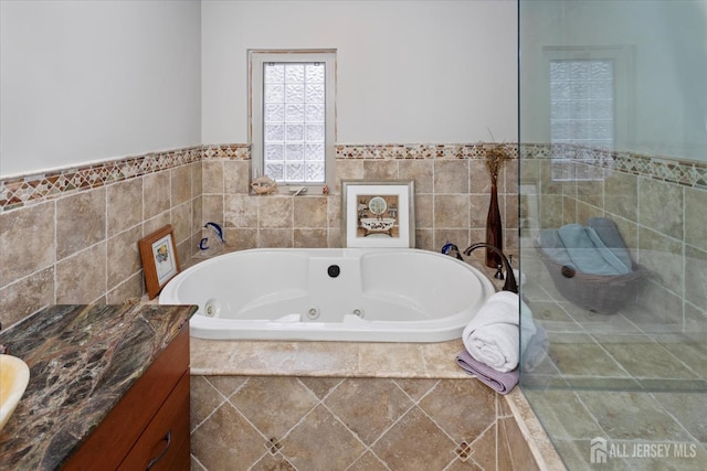 75 Brown Rd, Howell, NJ 07731 - bathroom with a jetted tub, vanity, tiled shower, and a wainscoted wall