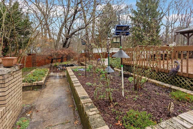 75 Brown Rd, Howell, NJ 07731 - view of yard with a wooden deck and a vegetable garden