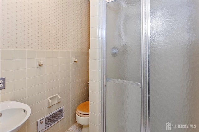 75 Brown Rd, Howell, NJ 07731 - full bathroom with tile walls, a stall shower, wallpapered walls, and wainscoting
