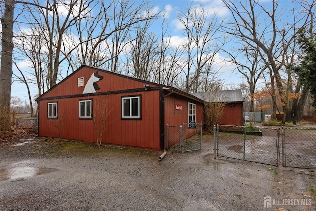75 Brown Rd, Howell, NJ 07731 - view of side of home with a gate