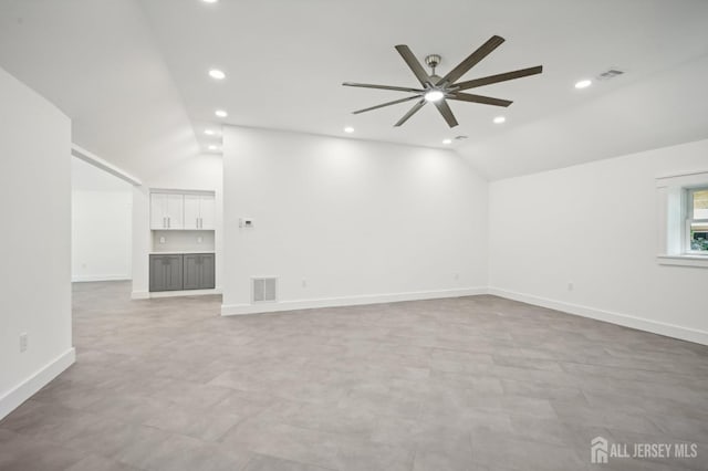 unfurnished living room with visible vents, baseboards, ceiling fan, vaulted ceiling, and recessed lighting