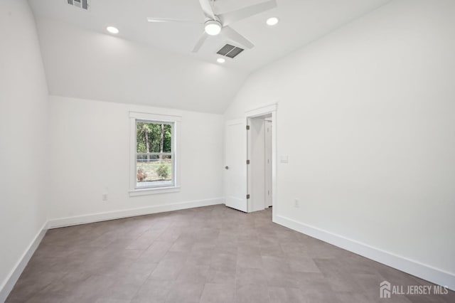 spare room with ceiling fan and lofted ceiling