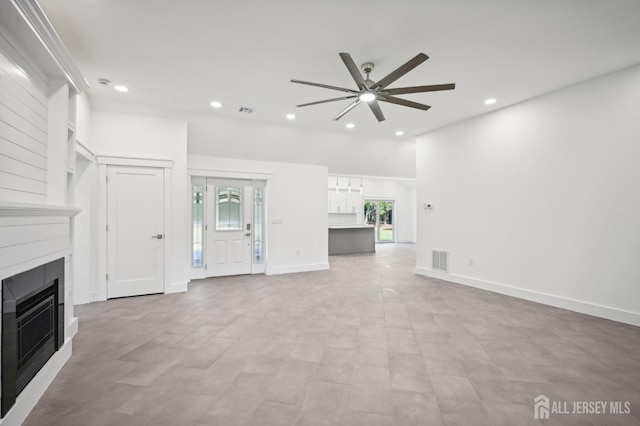 unfurnished living room featuring a ceiling fan, recessed lighting, visible vents, and a fireplace