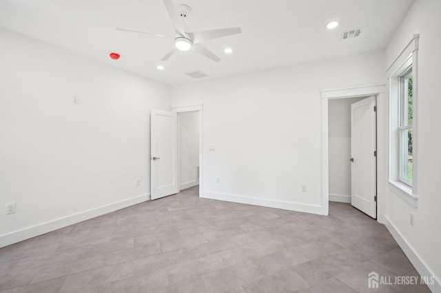 unfurnished bedroom with a ceiling fan, recessed lighting, visible vents, and baseboards