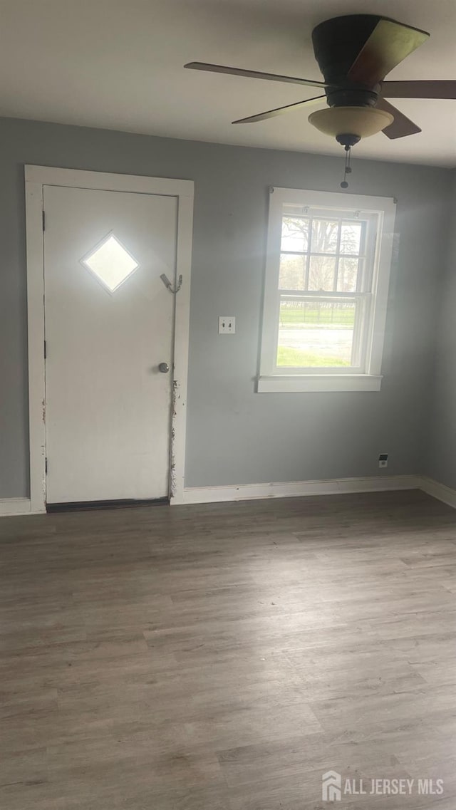 144 Inman Ave, Colonia, NJ 07067 - foyer with wood finished floors, baseboards, and a ceiling fan
