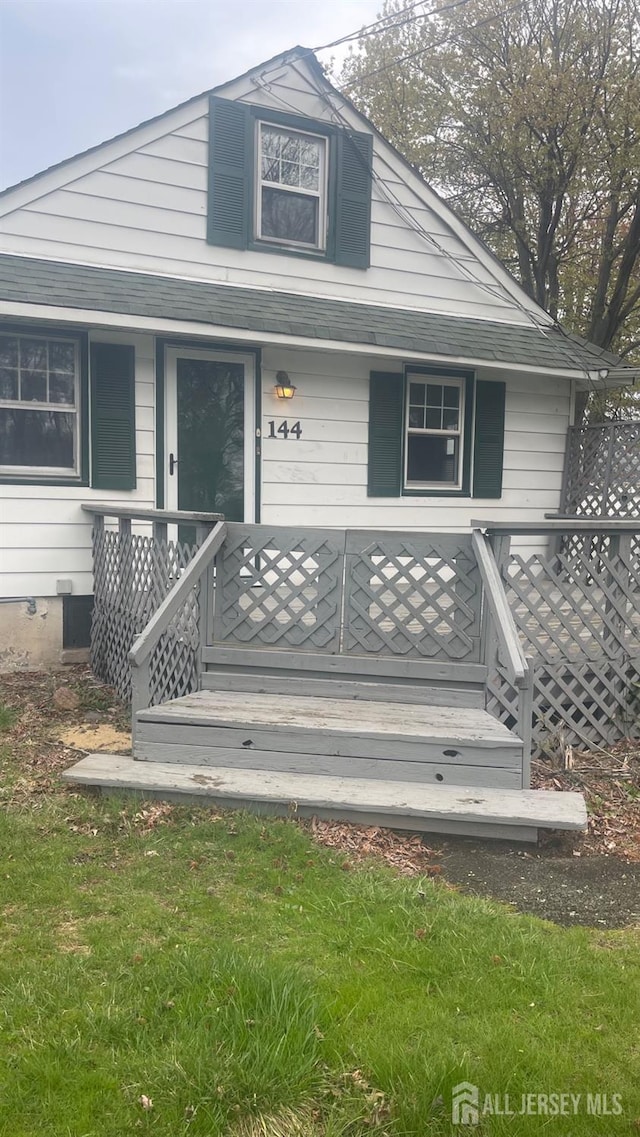 144 Inman Ave, Colonia, NJ 07067 - property entrance featuring a shingled roof and covered porch