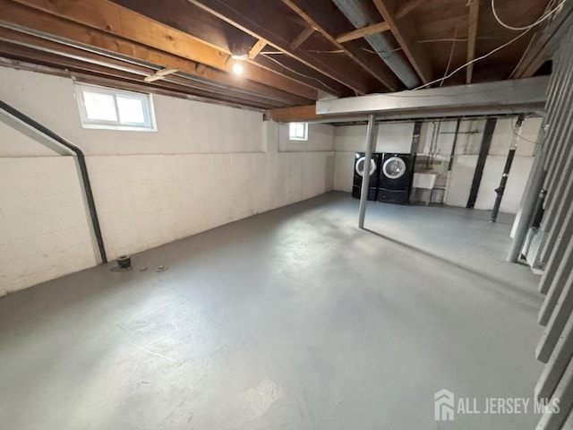 below grade area featuring washer / dryer
