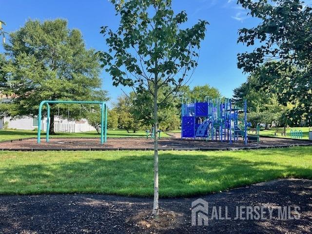 community playground featuring a yard