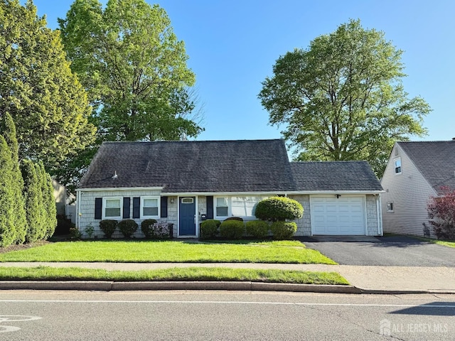 25 Lake Ave, Colonia, NJ 07067 - cape cod home featuring an attached garage, asphalt driveway, and a front yard