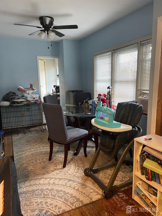 dining area featuring ceiling fan and wood finished floors