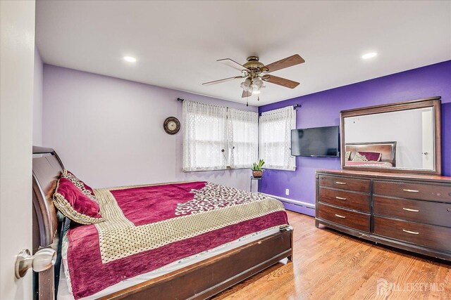 bedroom featuring a ceiling fan, recessed lighting, baseboards, and wood finished floors