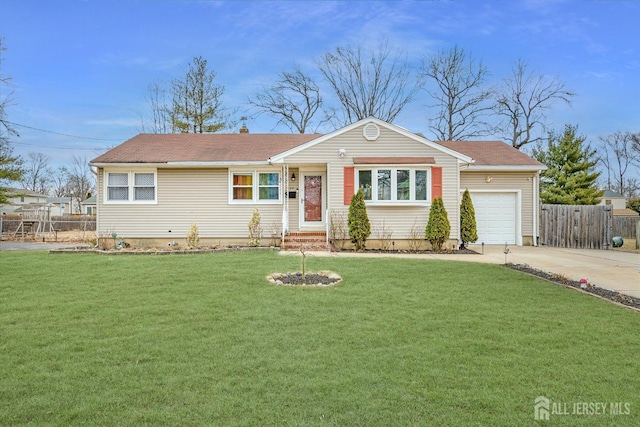 single story home featuring entry steps, a garage, fence, concrete driveway, and a front lawn