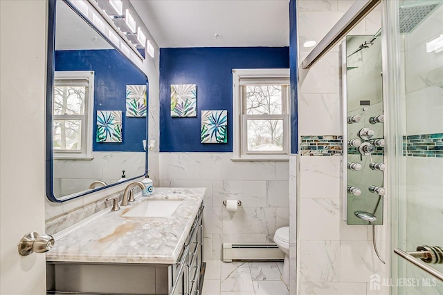 full bathroom with toilet, vanity, marble finish floor, baseboard heating, and a shower stall