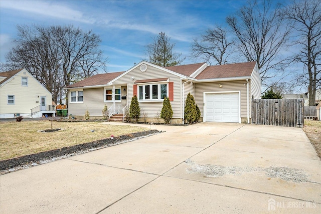 ranch-style home with an attached garage, entry steps, fence, driveway, and a front lawn