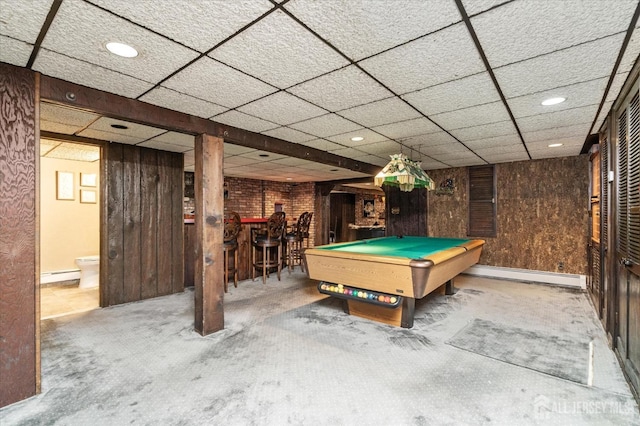 game room featuring billiards, a baseboard heating unit, carpet, and wood walls