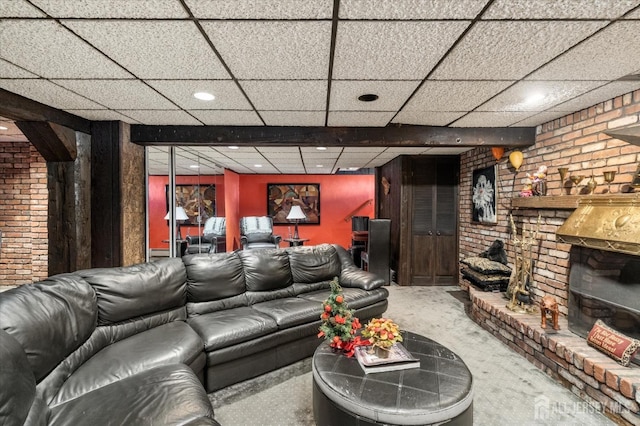 cinema room with brick wall and carpet flooring