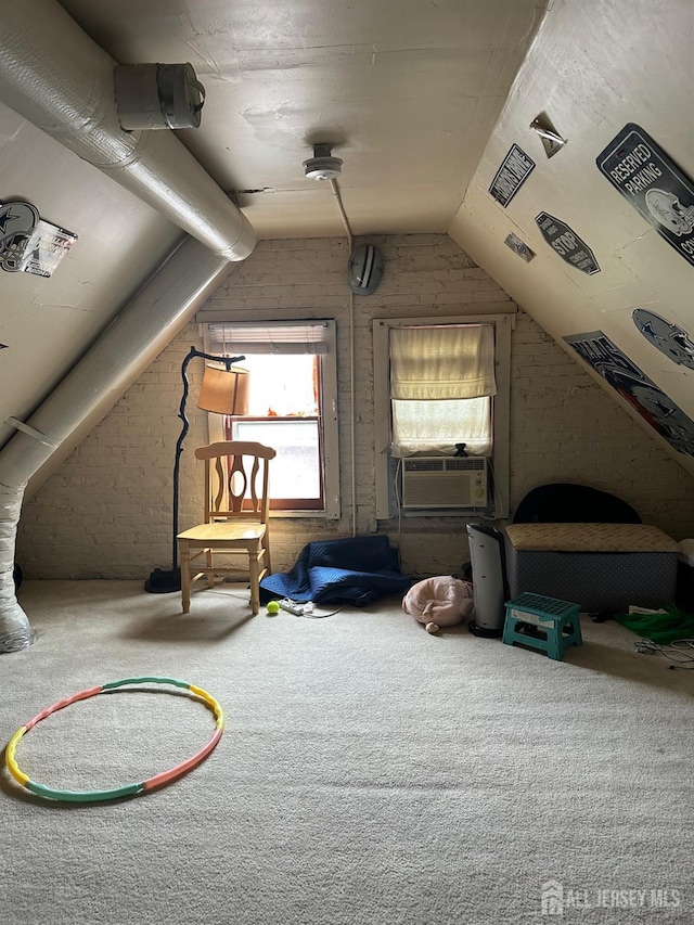 290 Redmond St, New Brunswick, NJ 08901 - bonus room featuring carpet flooring, vaulted ceiling, cooling unit, and brick wall