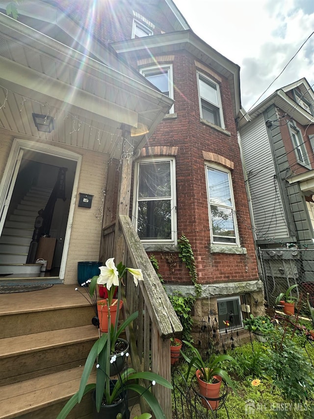 290 Redmond St, New Brunswick, NJ 08901 - view of exterior entry featuring brick siding