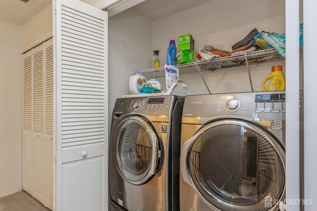 washroom with washer and dryer and laundry area