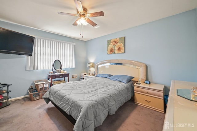 bedroom with carpet flooring, baseboards, and ceiling fan