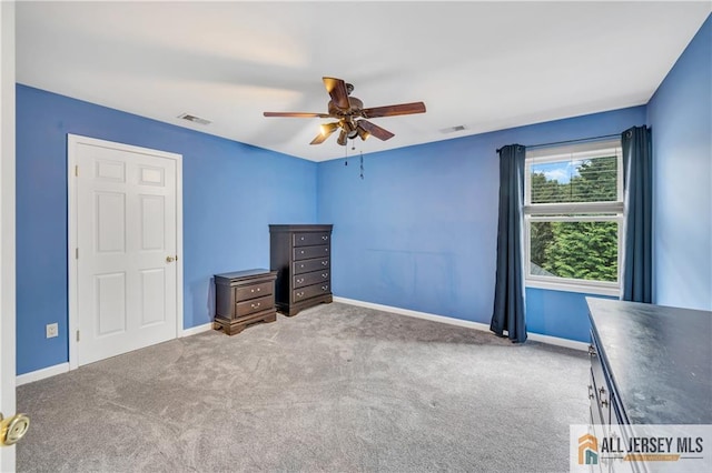 unfurnished bedroom with carpet flooring, baseboards, and ceiling fan