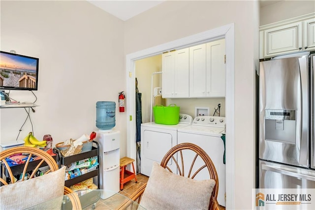 laundry room with cabinet space and independent washer and dryer