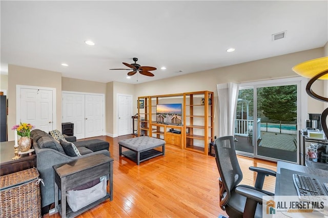 office area featuring a ceiling fan, light wood finished floors, and recessed lighting