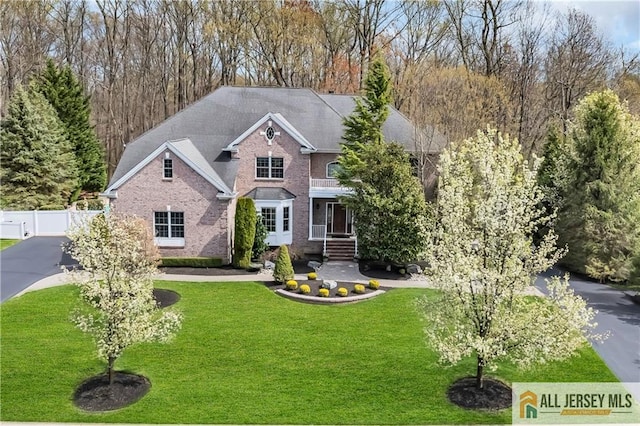 view of front of house featuring brick siding