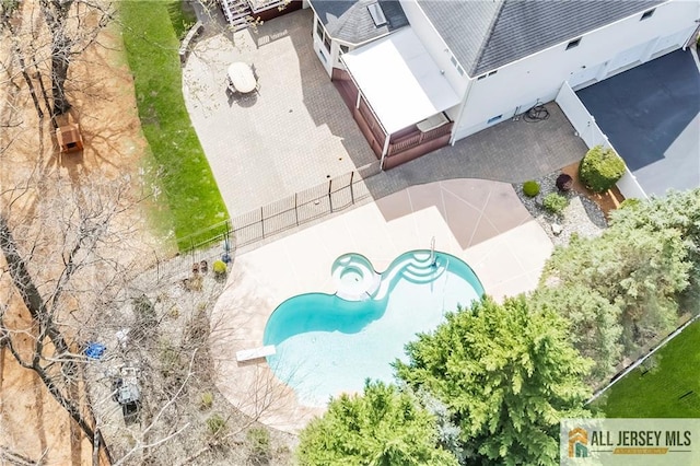 view of subject property with a pool area