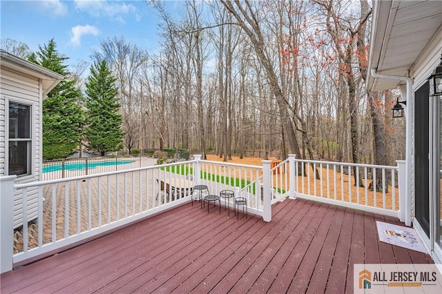 deck featuring an outdoor pool