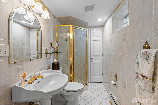 full bathroom featuring tile walls, tile patterned flooring, a shower stall, toilet, and recessed lighting