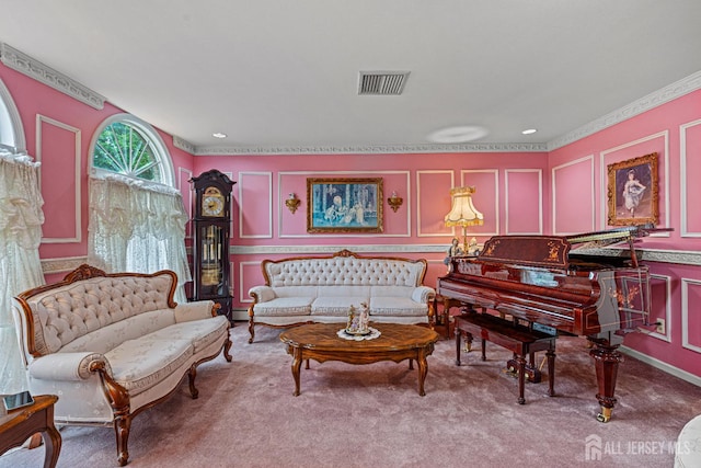 sitting room featuring a decorative wall, ornamental molding, and carpet floors