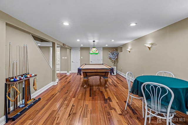 rec room with pool table, wood finished floors, baseboards, recessed lighting, and a baseboard radiator