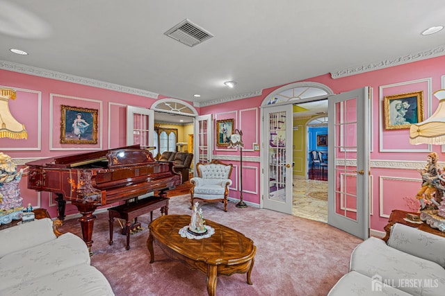 carpeted living room featuring french doors