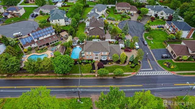 view of property location featuring nearby suburban area and a pool