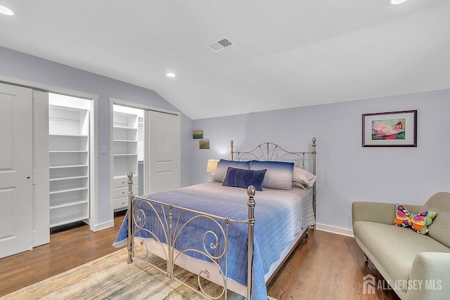 107 Sayre Dr, Plainsboro, NJ 08540 - bedroom featuring vaulted ceiling, multiple closets, wood finished floors, and recessed lighting