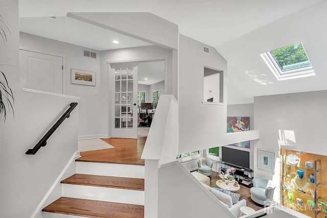 107 Sayre Dr, Plainsboro, NJ 08540 - staircase with a skylight, lofted ceiling, wood finished floors, and recessed lighting