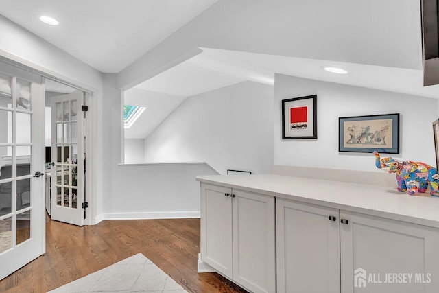 107 Sayre Dr, Plainsboro, NJ 08540 - corridor featuring french doors, lofted ceiling, wood finished floors, and recessed lighting