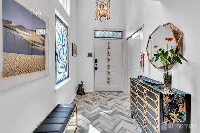 107 Sayre Dr, Plainsboro, NJ 08540 - foyer entrance with a towering ceiling and a chandelier