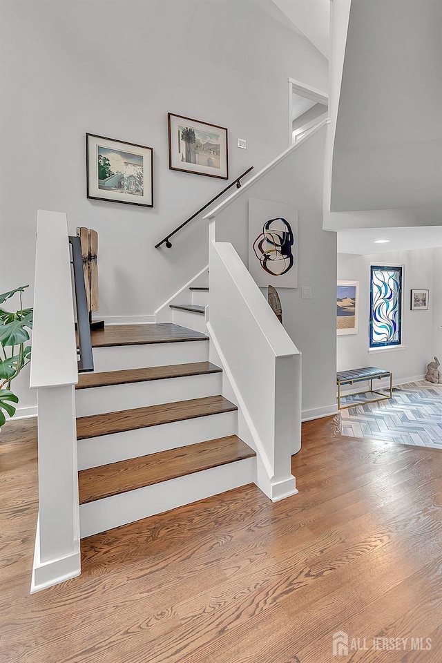 107 Sayre Dr, Plainsboro, NJ 08540 - staircase with wood finished floors and baseboards