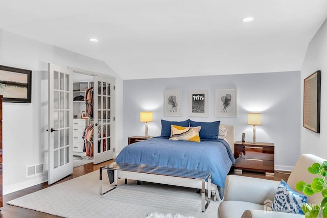 107 Sayre Dr, Plainsboro, NJ 08540 - bedroom with french doors, wood finished floors, recessed lighting, and lofted ceiling