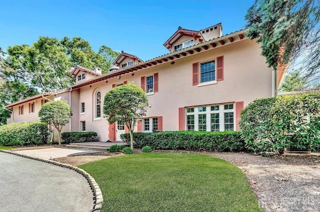 107 Sayre Dr, Plainsboro, NJ 08540 - mediterranean / spanish home featuring stucco siding and a front lawn