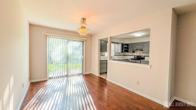 1204 Maplecrest Rd, Edison, NJ 08820 - unfurnished dining area with dark wood-style flooring and baseboards